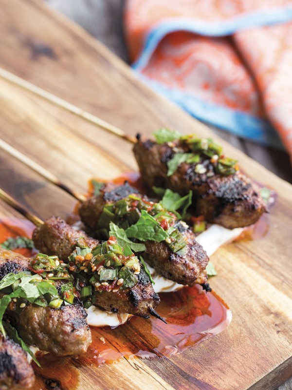 Szechuan sausage skewers with minty yogurt