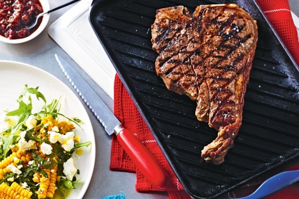 T-bone steaks with smoky barbecue sauce and corn salad