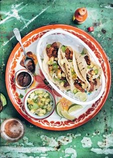 Tacos al pastor with pineapple & smoky ancho chilli salsa