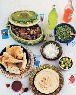 Tacos of carnitas roasted with orange, milk, and pepper