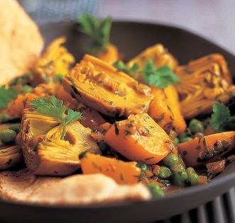 Tagine of artichoke hearts, potatoes, peas and saffron