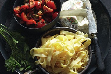 Tagliatelle with marinated tomatoes and goat's cheese