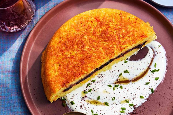 Tahchin with sour cherries and yogurt sauce