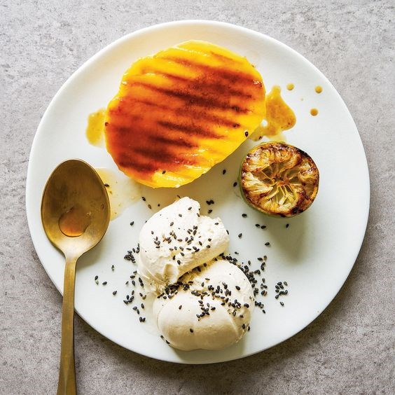 Tahini ice cream with griddled mango and lime