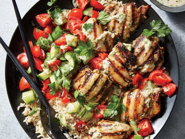 Tahini-marinated chicken thighs with cucumber-and-tomato salad