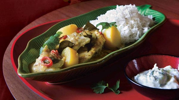 Tamarind fish and potato curry with raita and steamed rice