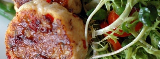 Tamarind-glazed crab cake with chive flowers (Bánh cua)