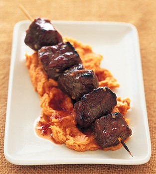 Tamarind-honey lamb kebabs on mashed yams