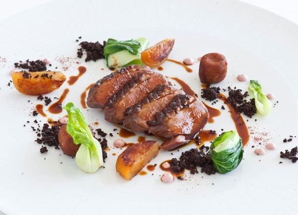 Tandoori duck breast with duck croquettes, apricots and pak choi