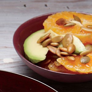 Tangerine and avocado salad with pumpkin seeds