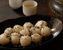 Tea-infused sticky sesame dumplings