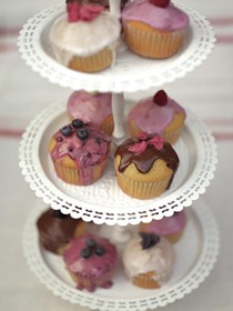 Tea-party fairy cakes with fresh fruit icing