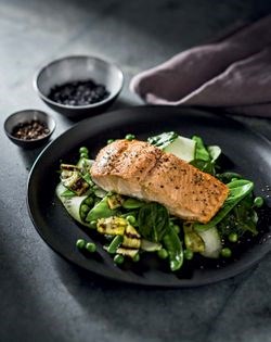 Tea-smoked Norwegian salmon with grilled courgettes and peas