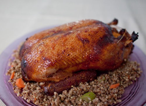 Tea smoked whole duck with plum wine sauce