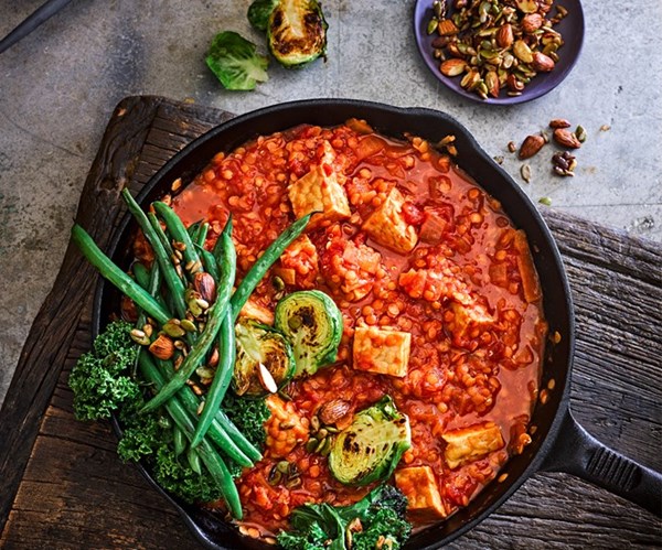 Tempeh & red lentil curry with roasted greens & tamari nuts & seeds