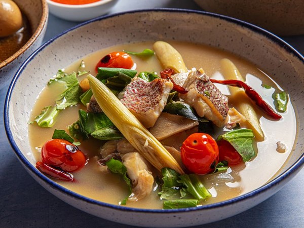Thai spicy and sour soup with fish (Tom yam pla)