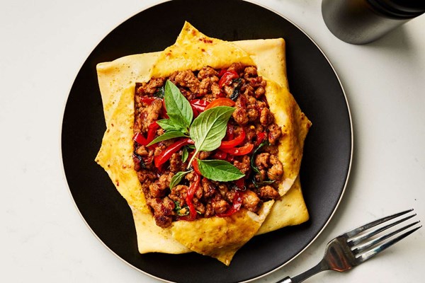 Thai-stuffed spicy basil-chicken omelet (Krapow khai yat sai)