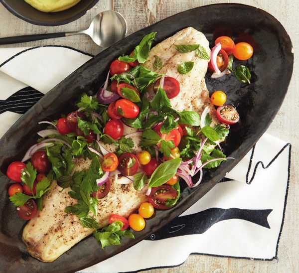 The Blue Heron's striped bass with summer herbs, tomatoes, and aioli