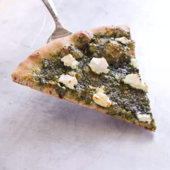 Thin-crust whole-wheat pizza with pesto and goat cheese