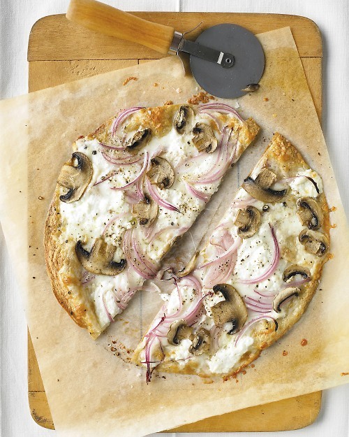 Thinnest-crust pizza with ricotta and mushrooms