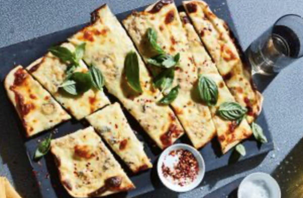 Three-cheese and basil pizza