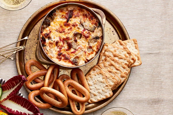 Three-cheese artichoke-and-sun-dried-tomato dip