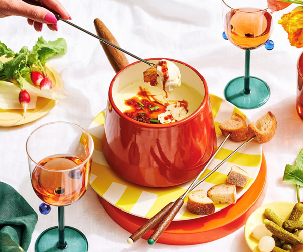 Three-cheese fondue with chorizo oil and crudités