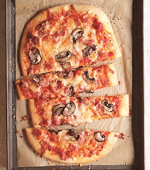 Three-cheese pizza with pancetta and mushrooms