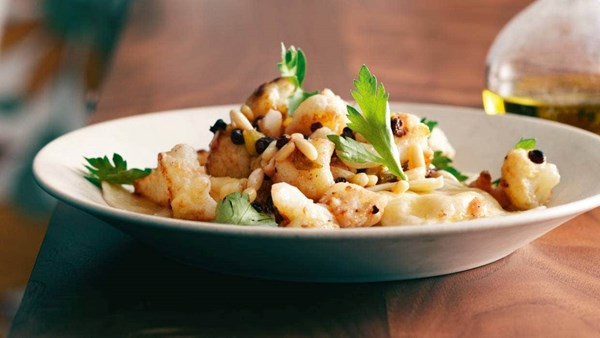 Three cheese ravioli with cauliflower, currants and pine nuts