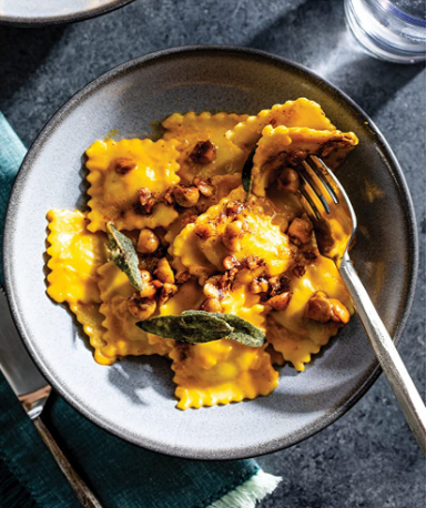 Three-cheese ravioli with pumpkin cream sauce