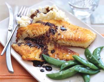 Tilapia with balsamic butter sauce, thyme mashed potatoes, and sugar snap peas