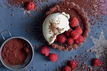 Tim tam tarts with raspberries and tim tam 'soil'