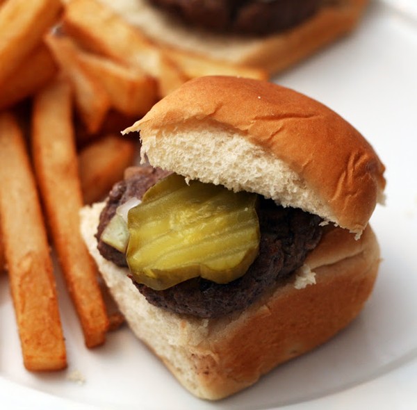 Tiny burgers with pickles and onions