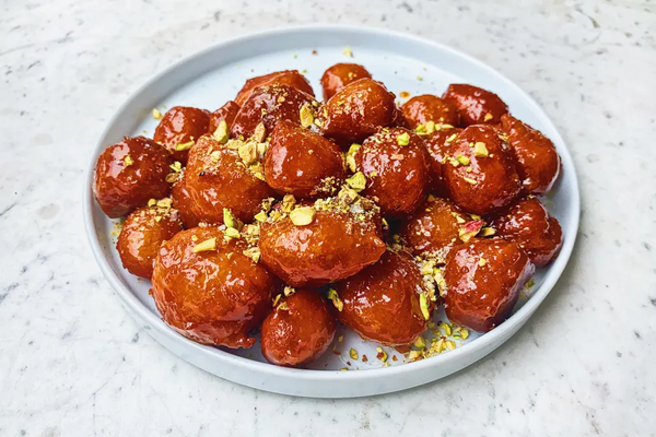 Tiny doughnuts with orange-honey glaze