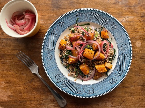 Toasted farro salad with spice-roasted squash, kale ribbons, and pickled onion