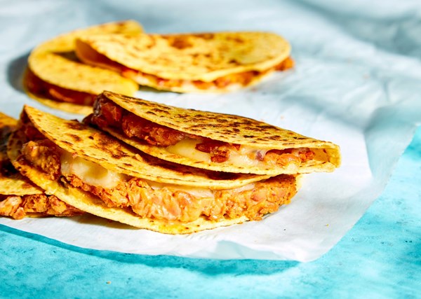 Toasted tacos with adobo beans and cheese