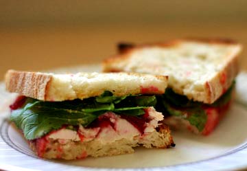Toasted turkey cranberry arugula sandwich