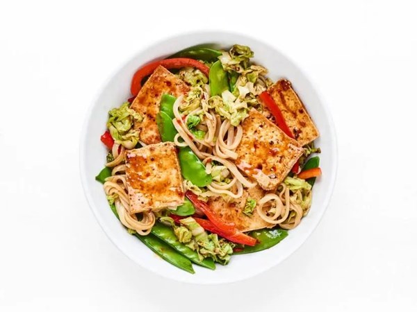 Tofu and vegetable stir-fry with rice noodles