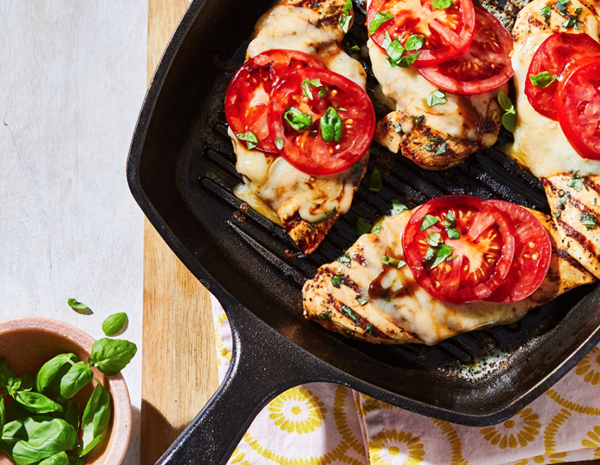 Tomato- & mozzarella-smothered grilled chicken