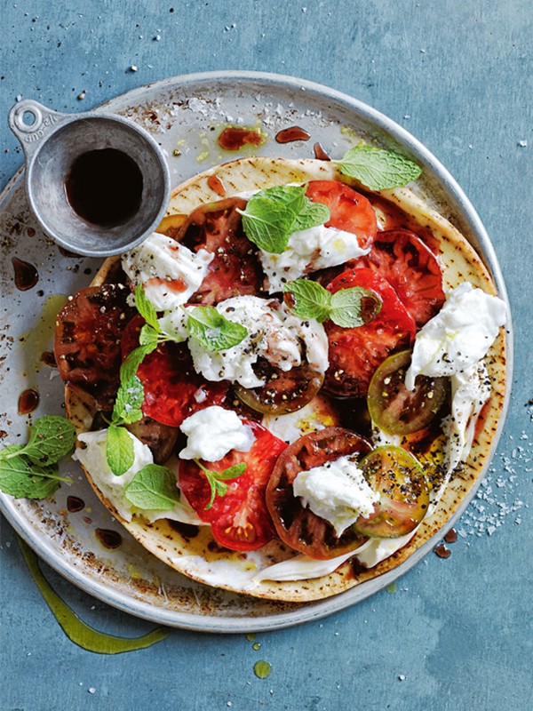 Tomato and buffalo mozzarella pizzas with fig vincotto
