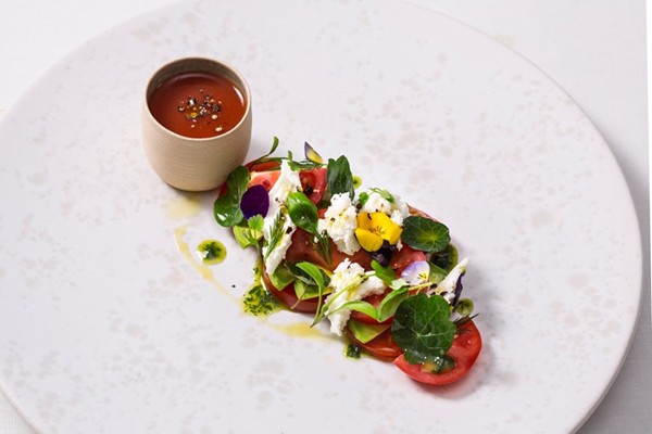 Tomato and mozzarella salad with lovage pesto and spiced gazpacho