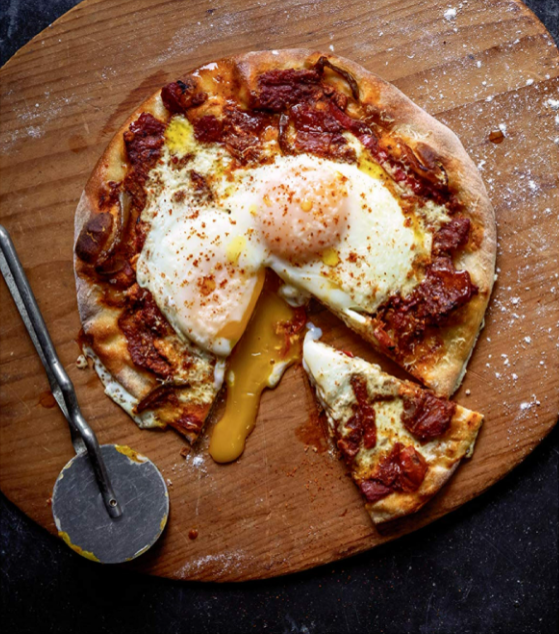 Tomato and pepper pizzas with sunny-side-up eggs