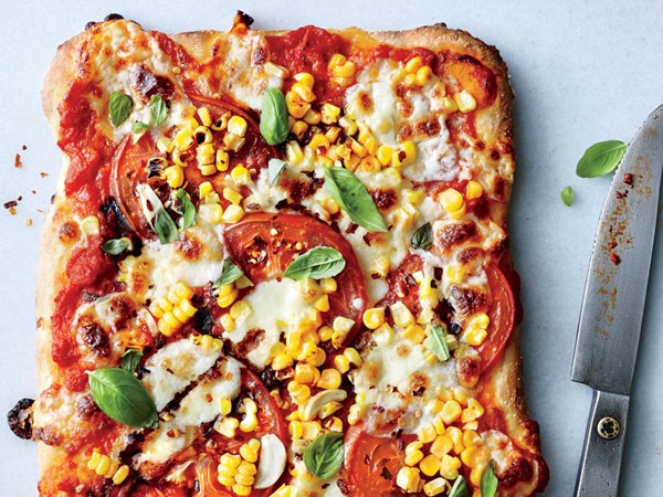 Tomato, basil, and corn pizza