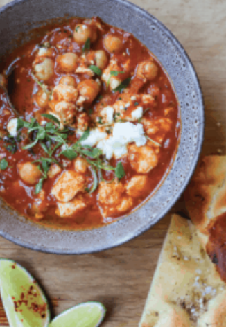 Tomato braised chickpeas with queso fresco and lime