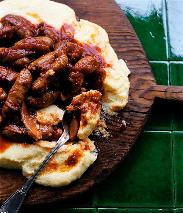 Tomato-braised sausages on Parmesan polenta