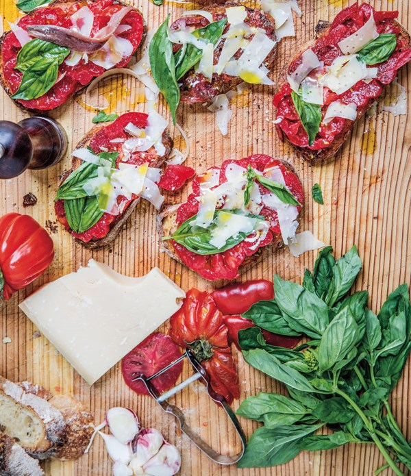 Tomato bruschetta with anchovies, Parmigiano Reggiano and basil
