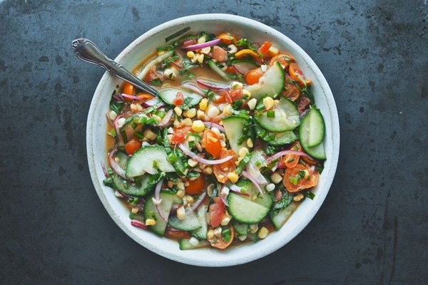 Tomato, cucumber, corn and herb summer salad