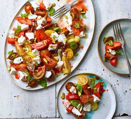 Tomato, goat's curd & basil salad with raspberry vinegar dressing