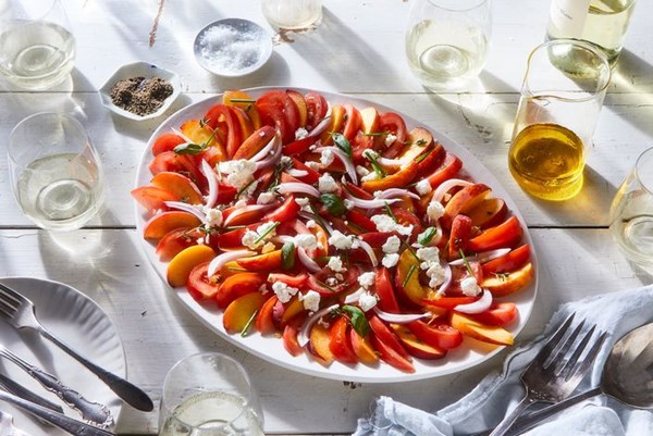 Tomato, peach, chèvre, and herb salad with apple vinaigrette 