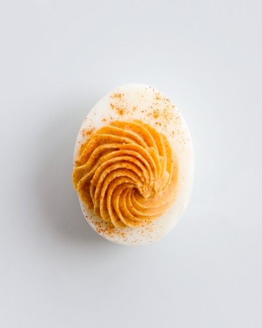 Tomato-pimentón deviled eggs